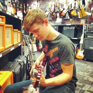Tim testing out guitars